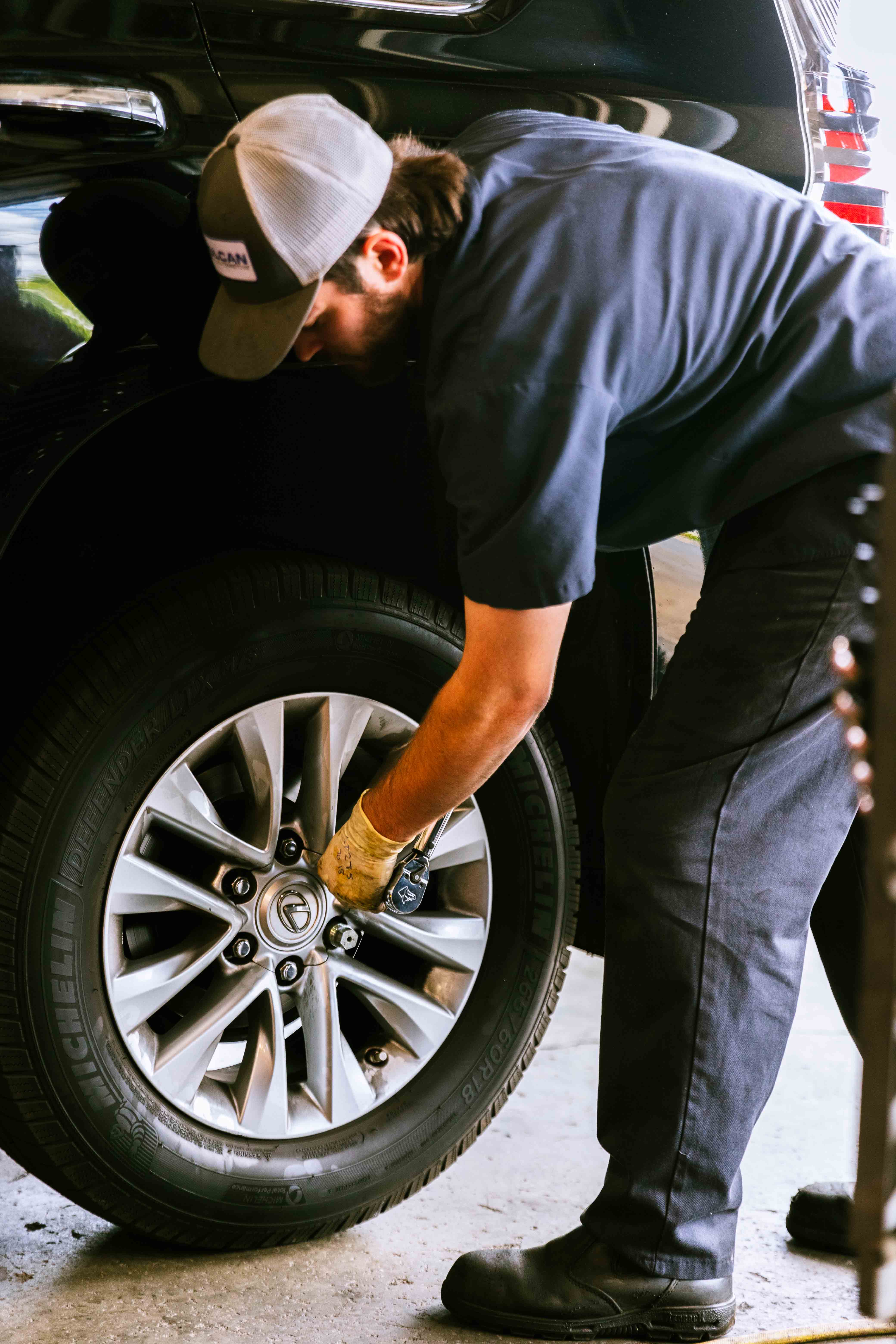 man changing tire